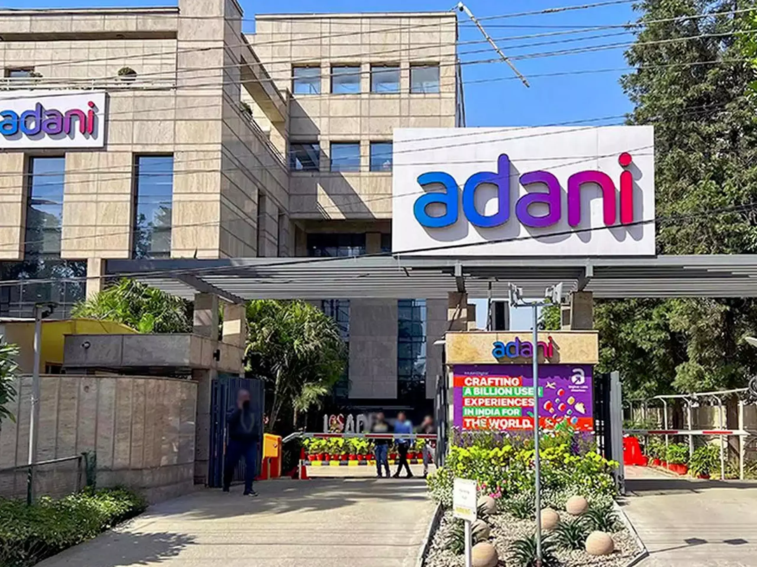 What is the reason for the surge in Adani Group shares
