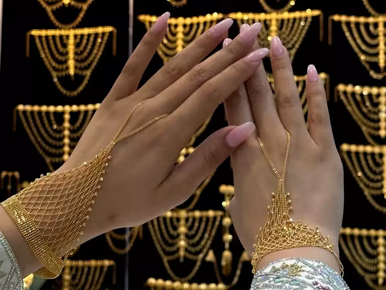 Kalyan Jewellers showroom and stock market growth chart showing 90 percent profit increase. Kalyan Jewellers showroom and stock market growth chart showing 90 percent profit increase.